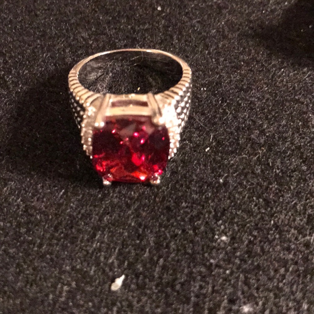 Silver and a Ruby Stone with Cubic on sides